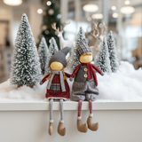 Figurina seduta di Olaf del ragazzo di Natale