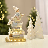 Pastel Christmas Figurine Child on Reindeer