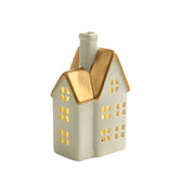 Grande statuetta di chalet natalizio con tetto dorato