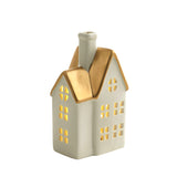 Grande statuetta di chalet natalizio con tetto dorato