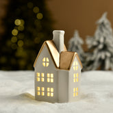 Grande statuetta di chalet natalizio con tetto dorato