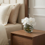 Composition d'Orchidée en vase rond Chloé