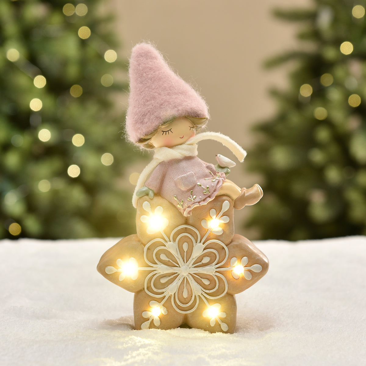 Figurine de Noël Fillette à bonnet rose sur Flocon LED