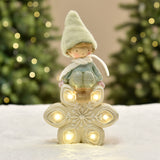 Christmas Figurine Boy with Green Hat on LED Snowflake