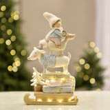 Pastel Christmas Figurine Child on Reindeer