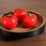 Tomates artificielles rouges Sia Deco sur plateau rond en bois marron 