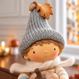 Figurine de Noël Garçon assis Pumpkin 15 cm crème en polyrésine, décoration de Noël à poser, focus produit, Sia Deco